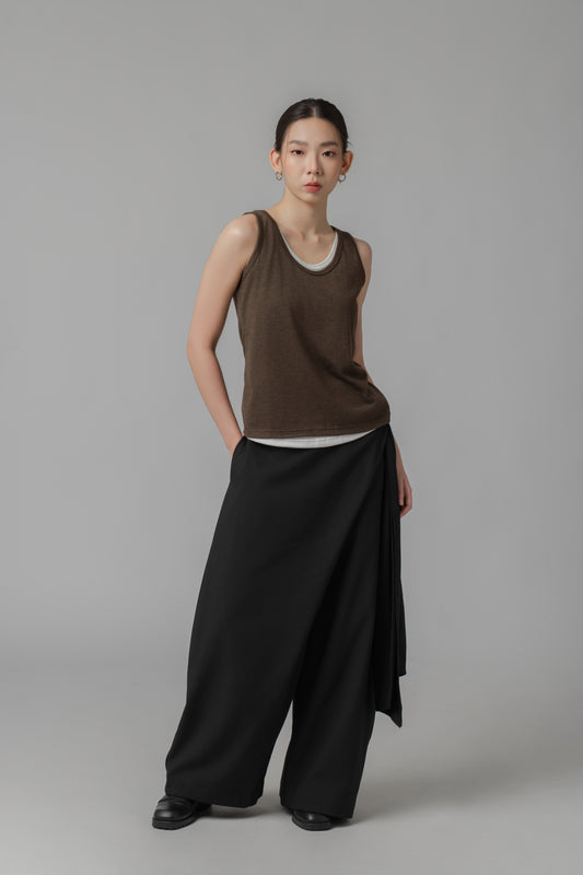 Woman wearing a dark brown two-layer tank top and black wide-leg pants